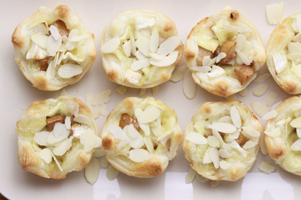 image showing how to drizzle the bites with honey and sprinkle with almond slices